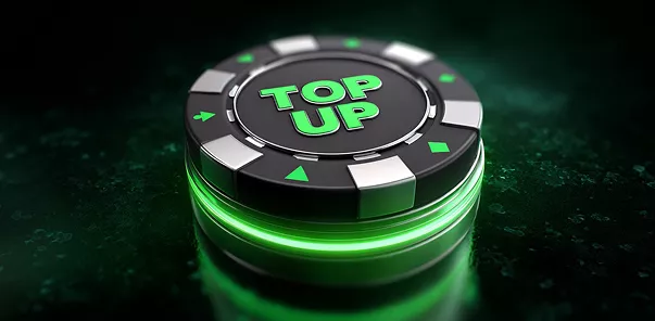 Un jeton de casino noir et argent avec le texte vert lumineux "TOP UP" au centre, placé sur une surface sombre avec un éclat vert